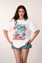 Woman wearing a white t-shirt with colorful graphic design and text saying Marriage Material.
