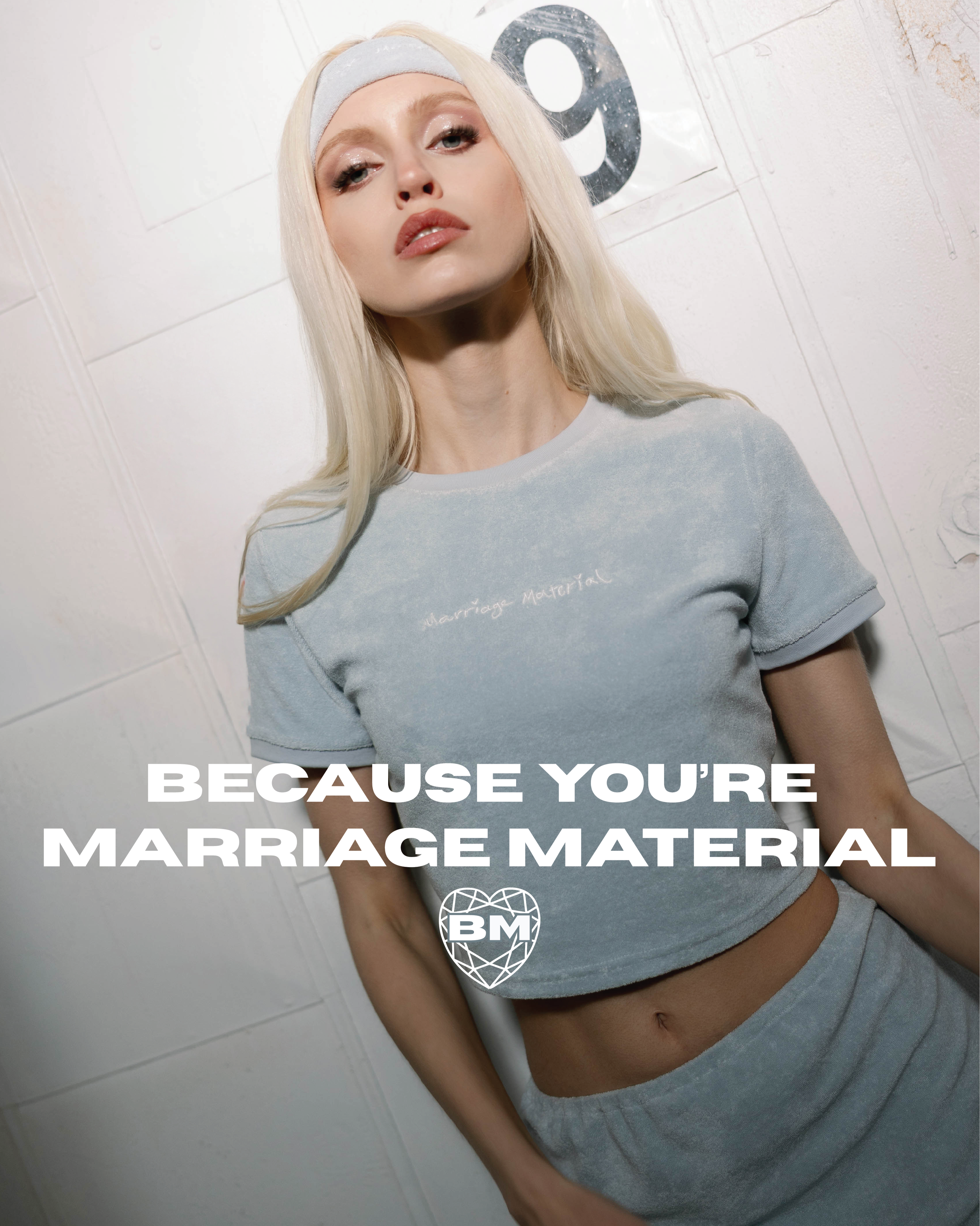'Because You’re Marriage Material™' homepage banner featuring model in blue terry bridal set