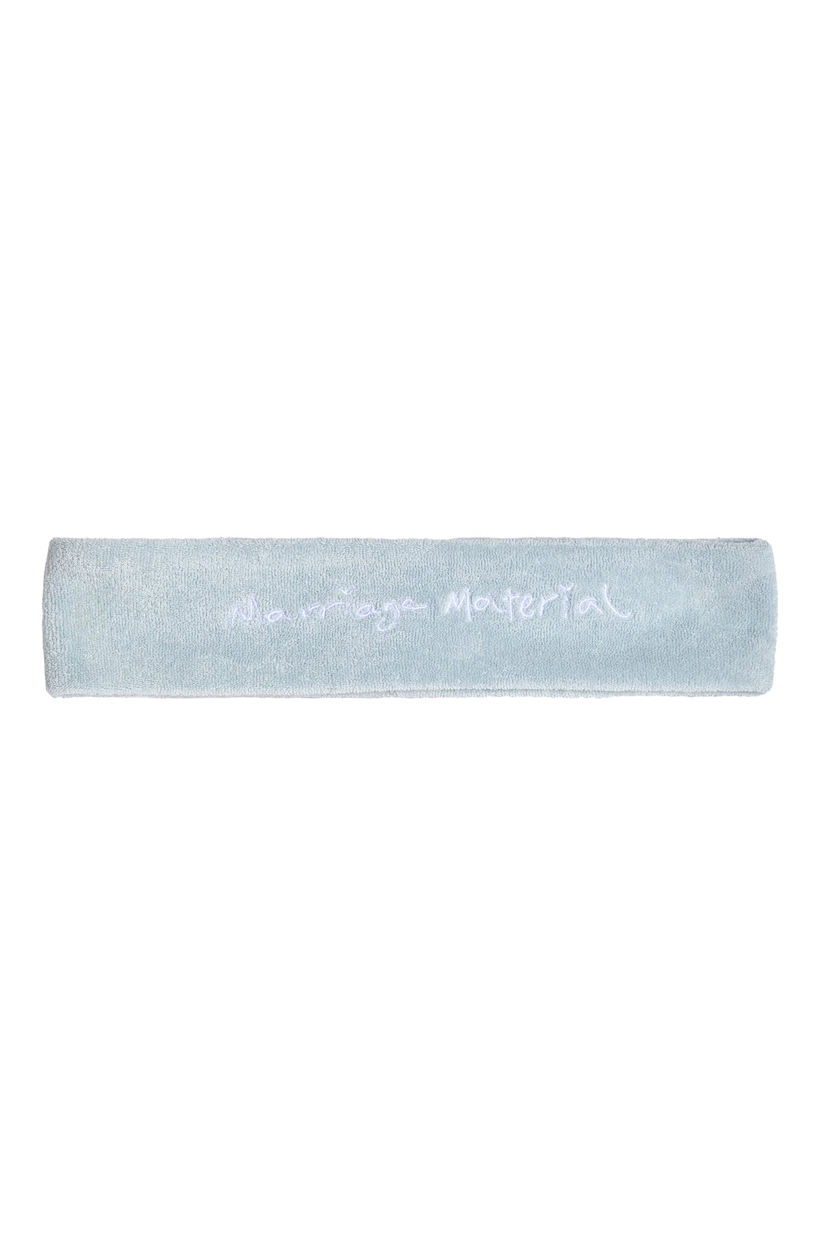 Flat lay of white terry cloth headband with 'Marriage Material™' embroidery