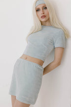 Blue bridal midi skirt with "Marriage Material™" embroidery, modeled in styled pose